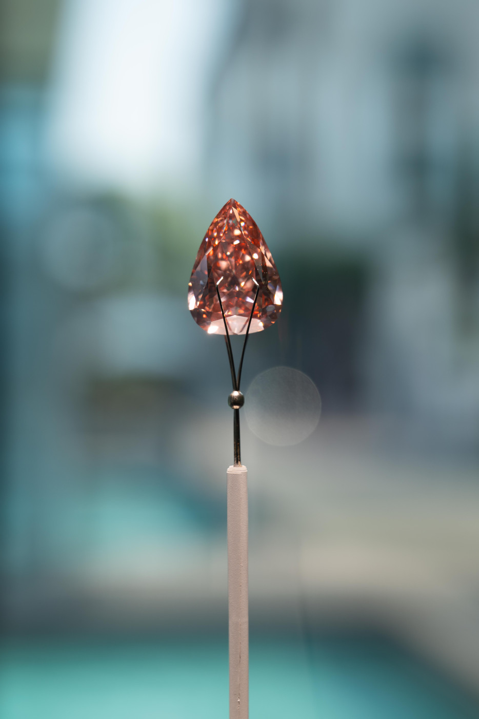 The Desert Rose, A pearl-shaped Fancy Vivid Orangy Pink diamond, estimate $5-7m